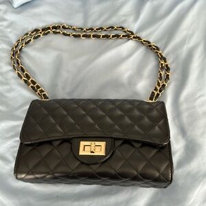 Black and gold hand bag